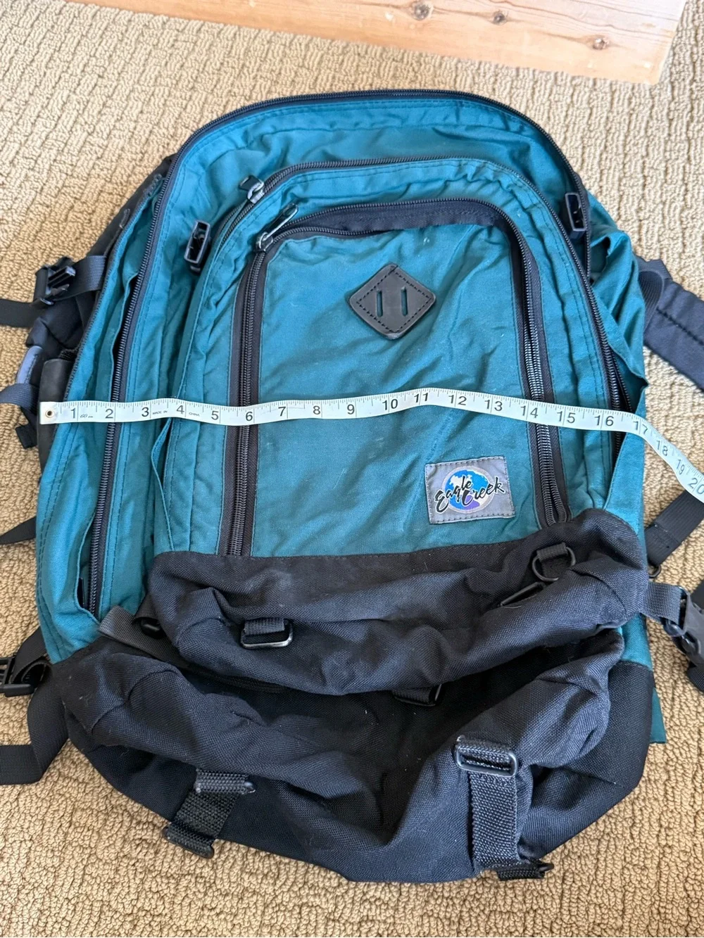 Teal and Black Vintage Eagle Creek Backpack with a day pack attached.